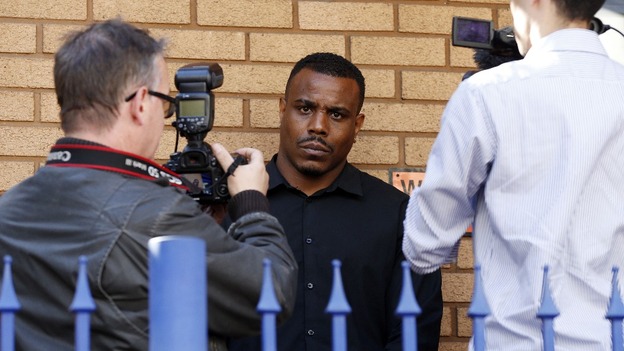 Rapper Mike GLC outside police station earlier this week